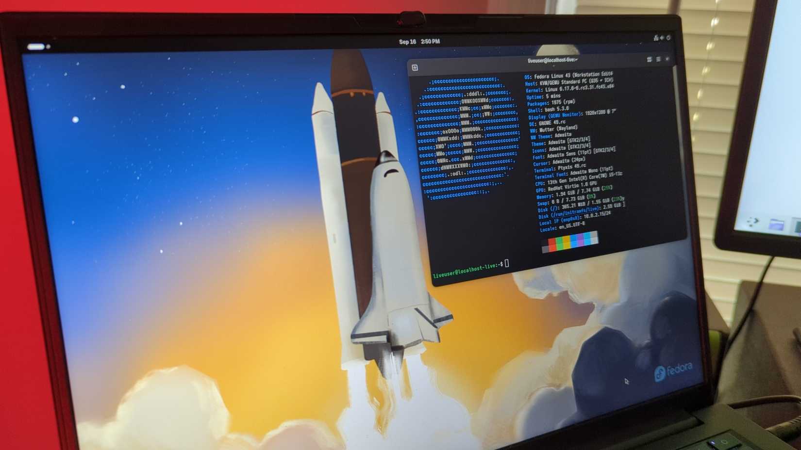 Fedora Linux 43 beta with the GNOME desktop on a laptop screen.