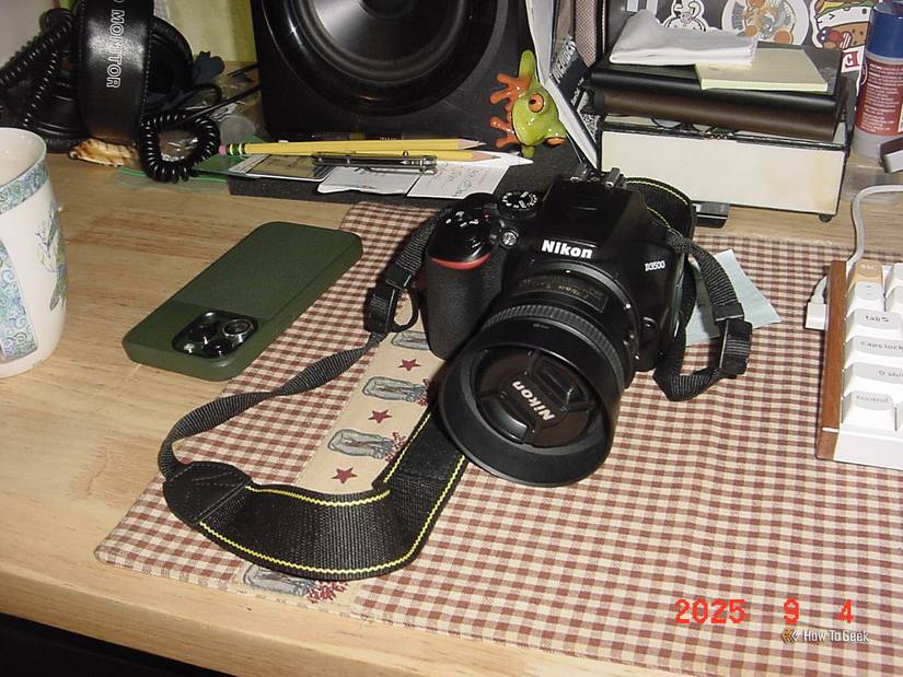 Photo of a modern camera and smartphone shot on the Sony Mavica camera.